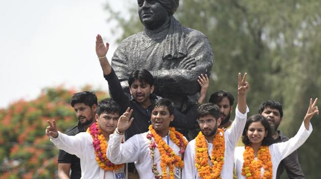 NSUI candidates Rocky Tussed, Kunal Sahrawat, Meenakshi Meena, and Avinash Yadav for the DUSU polls, in North Campus on Wednesday.(Sushil Kumar/HT Photo)