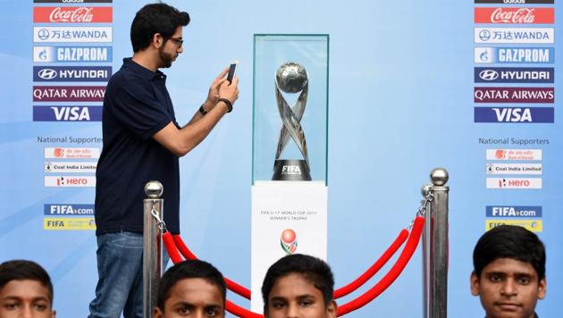 Aditiya Thackeray clicks a picture of the FIFA U-17 Wordl Cup winners trophy. (Hindustan Times) Aditiya Thackeray clicks a picture of the FIFA U-17 Wordl Cup winners trophy. (Hindustan Times)