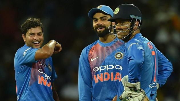 Kuldeep Yadav, Virat Kohli and MS Dhoni celebrate the dismissal of a Sri Lankan batsman during the one-off T20 in Colombo.(PTI)