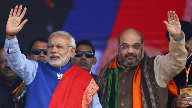 Indian Prime Minister Narendra Modi (L) and Amit Shah, the president of India's ruling Bharatiya Janata Party (BJP), wave to their supporters during a campaign rally ahead of state assembly elections, at Ramlila ground in New Delhi. (REUTERS File Photo) Indian Prime Minister Narendra Modi (L) and Amit Shah, the president of India's ruling Bharatiya Janata Party (BJP), wave to their supporters during a campaign rally ahead of state assembly elections, at Ramlila ground in New Delhi. (REUTERS File Photo)