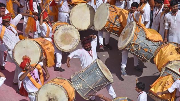 Members of a dhol tasha squad during the Ganesh visarjan procession in Pune on Tuesday.  (Pratham Gokhale/HT PHOTO) 