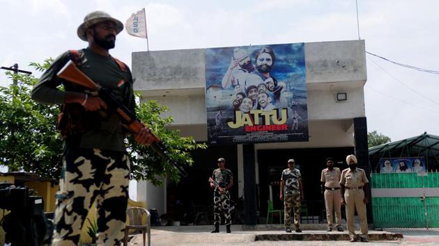 Cops standing guard before huge posters of Gurmeet Ram Rahim’s latest movie ‘Jattu Engineer’ near the naam charcha ghar at Patran in Patiala. (Anil dayal/HT) Cops standing guard before huge posters of Gurmeet Ram Rahim’s latest movie ‘Jattu Engineer’ near the naam charcha ghar at Patran in Patiala. (Anil dayal/HT)