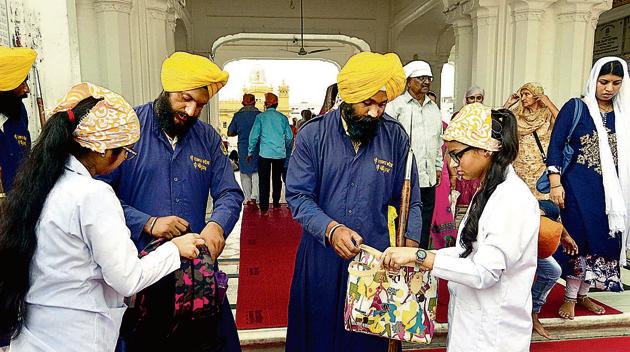 Members of the SGPC task force checking bags of devotees at the entrance to the Golden Temple in Amritsar on Wednesday. (Sameer Sehgal /HT) Members of the SGPC task force checking bags of devotees at the entrance to the Golden Temple in Amritsar on Wednesday. (Sameer Sehgal /HT)