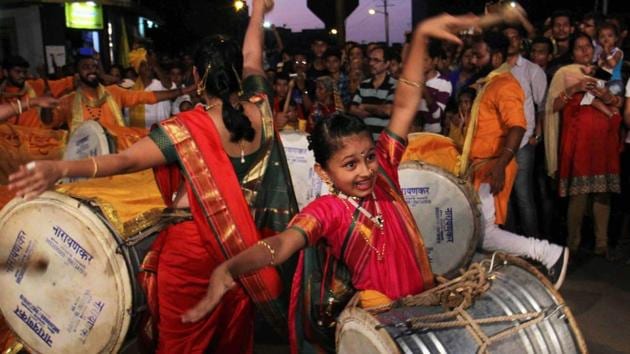 Vainavi plays a dhol in Swargandhar dhol tasha pathak as she dances and entertains the crowd during the last day of Ganpati Visarjan at Vasai in Mumbai. (Pramod Thakur/HT PHOTO) Vainavi plays a dhol in Swargandhar dhol tasha pathak as she dances and entertains the crowd during the last day of Ganpati Visarjan at Vasai in Mumbai. (Pramod Thakur/HT PHOTO)