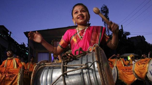 Vainavi feels a sense of camaraderie in the community despite being only eleven. Her command over the Nashik Dhol is evident in her ease of handling it even in the busiest of processions. (Pramod Thakur/HT PHOTO) Vainavi feels a sense of camaraderie in the community despite being only eleven. Her command over the Nashik Dhol is evident in her ease of handling it even in the busiest of processions. (Pramod Thakur/HT PHOTO)