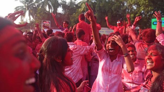 Devotees play with colours during Ganesh visarjan procession of Guruji Talim Ganpati in Pune on Tuesday.  (Pratham Gokhale/HT PHOTO) 