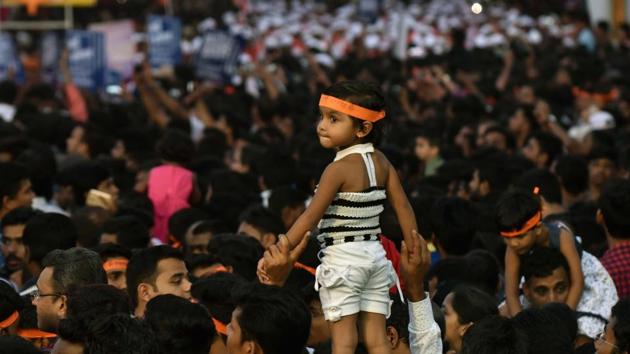 A child watches the Ganesh visarjan procession in Pune on Tuesday. (Pratham Gokhale/HT PHOTO) 