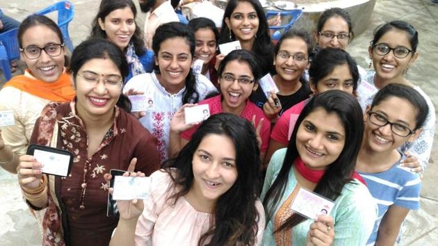 Students show their PU identity cards at the Panjab University campus on Thursday. 