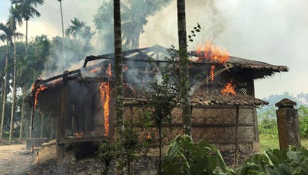 Houses are on fire in Gawdu Zara village, northern Rakhine state, Myanmar, Thursday, Sept. 7, 2017. Journalists saw new fires burning Thursday in the Myanmar village that had been abandoned by Rohingya Muslims, and where pages from the Quran were seen ripped and left on the ground. (AP Photo) Houses are on fire in Gawdu Zara village, northern Rakhine state, Myanmar, Thursday, Sept. 7, 2017. Journalists saw new fires burning Thursday in the Myanmar village that had been abandoned by Rohingya Muslims, and where pages from the Quran were seen ripped and left on the ground. (AP Photo)