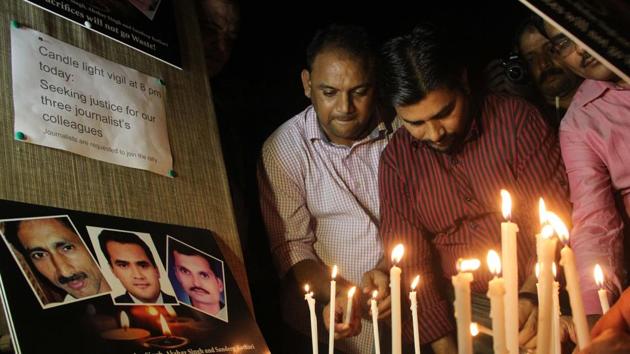 Candle light vigil seeking justice for journalists Akshay Singh, Jagendra Singh and Sandeep Kothari; who died in line of their work. Jagendra and Sandeep Kothari were brutally murdered, while Akshay Singh died in suspicious circumstances when probing the Vyapam scam. (Bhushan Koyande / HT Photo) 