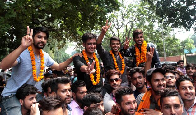 (From right) President Harsh Sharma, secratry Nitin Thakur, vice-president Harmanveer Singh and joint secretary Deepak Phor celebrating their victory at SD College in Sector 32 in Chandigarh. (Ravi Kumar/HT)