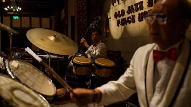 Often described as the oldest jazz band on the planet and once recognized as such by Guinness World Records, its six wizened members range from a relatively youthful 63 to a scarcely believable 97 year old trumpeter. They are an ‘institution’ in Shanghai and a rare constant in a region that is modernising at a breakneck speed. Jazz is most readily associated with New Orleans or New York but Shanghai isn’t far behind in staking claim. (Chandan Khanna / AFP) Often described as the oldest jazz band on the planet and once recognized as such by Guinness World Records, its six wizened members range from a relatively youthful 63 to a scarcely believable 97 year old trumpeter. They are an ‘institution’ in Shanghai and a rare constant in a region that is modernising at a breakneck speed. Jazz is most readily associated with New Orleans or New York but Shanghai isn’t far behind in staking claim. (Chandan Khanna / AFP)