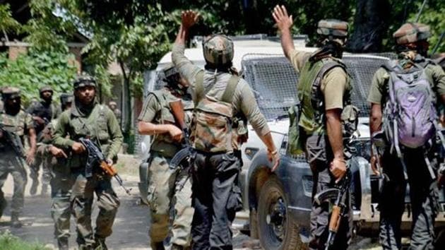Army soldiers in action outside a house where militants were hiding during an encounter in which top three Hizbul Mujahideen Commanders and two Army soldiers were killed, at Awneera in Shopian.(PTI File Photo) Army soldiers in action outside a house where militants were hiding during an encounter in which top three Hizbul Mujahideen Commanders and two Army soldiers were killed, at Awneera in Shopian.(PTI File Photo)