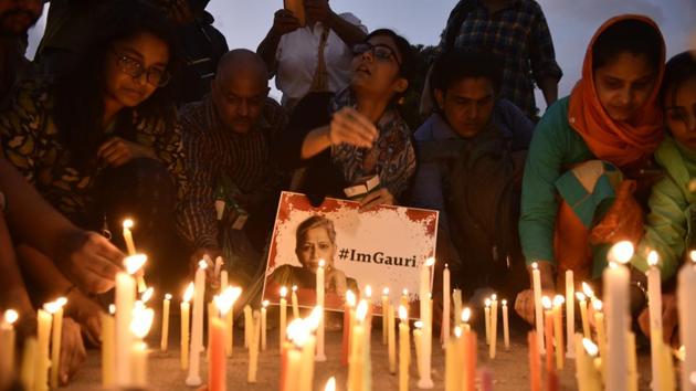 It is okay to hold candle -light vigils in her memory. But our collective show of support for a dead colleague must not end with just mere symbolism, but should rather translate into more substantive action.(Burhaan Kinu/HT PHOTO)