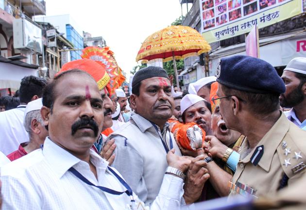 Muslim members help devotees of Kasba Ganpati mandal carry the Pakhi in Pune on Tuesday. (Sanket Wankhade/HT PHOTO) Muslim members help devotees of Kasba Ganpati mandal carry the Pakhi in Pune on Tuesday. (Sanket Wankhade/HT PHOTO)