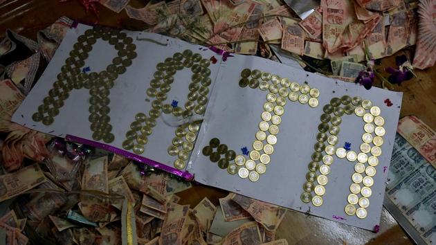 ROYAL TASK: The coins offered to the Lord. (Kunal Patil/HT Photo) 