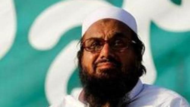 Hafiz Muhammad Saeed, chief of the banned Islamic charity Jamat-ud-Dawa, looks over the crowed as they end a "Kashmir Caravan" from Lahore with a protest in Islamabad, Pakistan July 20, 2016. REUTERS/Caren Firouz/Files Hafiz Muhammad Saeed, chief of the banned Islamic charity Jamat-ud-Dawa, looks over the crowed as they end a "Kashmir Caravan" from Lahore with a protest in Islamabad, Pakistan July 20, 2016. REUTERS/Caren Firouz/Files