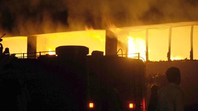 Fire that broke out on Wednesday at sector 68 in Noida reduced a factory of sweets and snacks manufacturer Haldiram to ashes. (HT Photo)