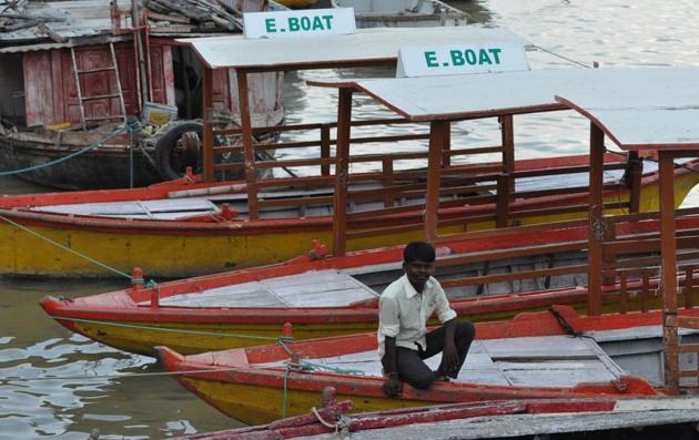 Boats anchored at Assi ghat for two months as batteries, motors taken off due to rising water in the Ganga.(HT Photo)