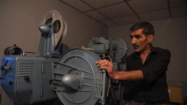 An employee preparing the screening of a film in a projection room at the state-run Afghan Film department in Kabul.(AFP) An employee preparing the screening of a film in a projection room at the state-run Afghan Film department in Kabul.(AFP)
