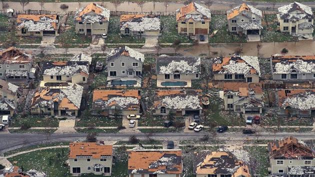 In this August 25, 1992, file photo, rows of damaged houses sit between Homestead and Florida City after Hurricane Andrew struck. Hurricane Andrew was a category 5 hurricane, the worst ever to hit the state with sustained wind speed of 165 miles per hour.  (AP) 