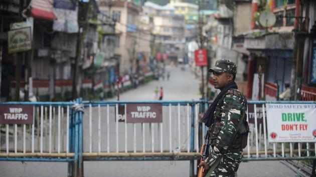 Paramilitary forces stand guard along a road in Kalimpong. The north Bengal hills have been reeling under an indefinite strike called by the Gorkha Janmukti Morcha (GJM) to demand a separate Gorkhaland state. (AFP) Paramilitary forces stand guard along a road in Kalimpong. The north Bengal hills have been reeling under an indefinite strike called by the Gorkha Janmukti Morcha (GJM) to demand a separate Gorkhaland state. (AFP)