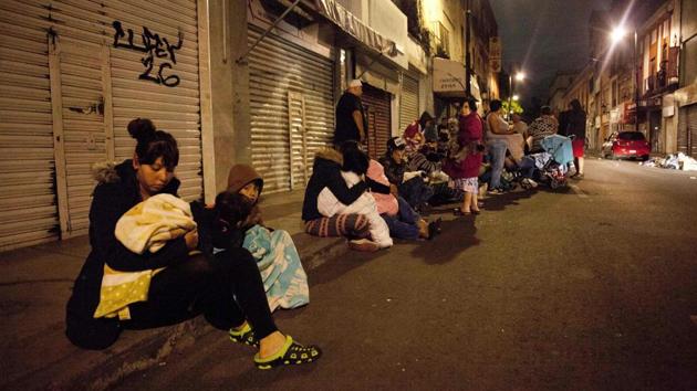 People in Mexico City ran out into the streets after the quake struck, a Reuters witness said. Rescue workers laboured through the night in badly affected areas to check for people trapped in collapsed buildings. (Pedro Pardo / AFP) People in Mexico City ran out into the streets after the quake struck, a Reuters witness said. Rescue workers laboured through the night in badly affected areas to check for people trapped in collapsed buildings. (Pedro Pardo / AFP)
