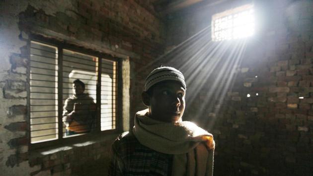 Children visiting their burnt house after Muzaffarnagar communal riots of  2013 in Uttar Pradesh  that left over 60 people dead.