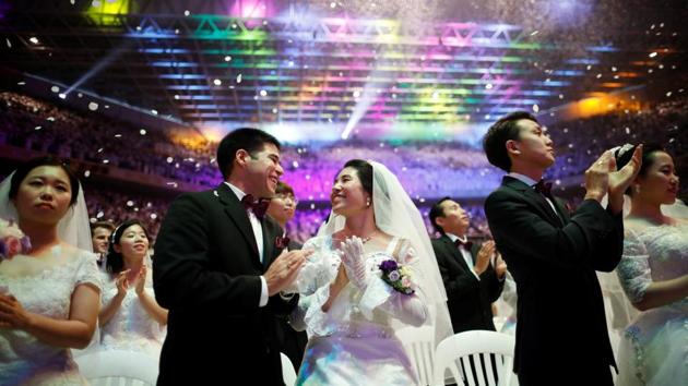 Thousands of Unification Church couples from around the world took part in a mass wedding on the occasion of the fifth death anniversary of its founder Sun Myung Moon, revered as a messiah by his followers at Cheongshim Peace World Centre in Gapyeong, South Korea on September 07, 2017. (Kim Hong-Ji / REUTERS) Thousands of Unification Church couples from around the world took part in a mass wedding on the occasion of the fifth death anniversary of its founder Sun Myung Moon, revered as a messiah by his followers at Cheongshim Peace World Centre in Gapyeong, South Korea on September 07, 2017. (Kim Hong-Ji / REUTERS)