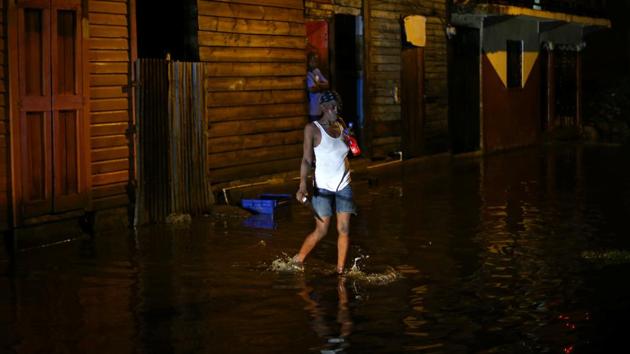 A woman walks through a flooded street after Hurricane Irma hit  Dominican Republic in Puerto Rico. Across the Caribbean, authorities rushed to evacuate tens of thousands of residents and tourists in the path of the storm. Another major hurricane, Jose, currently a Category 3 is expected to hit the northeastern Caribbean on Saturday. (Ivan Alvarado / REUTERS) 
