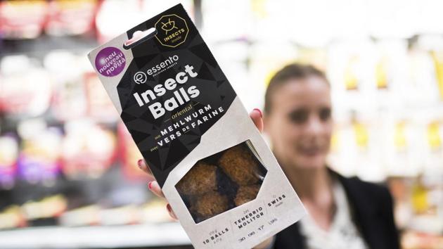An employee of a Coop supermarket shows a packet of insect balls in Lugano, Switzerland. (AP File Photo) An employee of a Coop supermarket shows a packet of insect balls in Lugano, Switzerland. (AP File Photo)