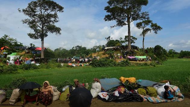 Rohingya refugees sit in front of newly built shelters at Kutupalong refugee camp in Bangladesh's Ukhiya district on September 9, 2017. (AFP) Rohingya refugees sit in front of newly built shelters at Kutupalong refugee camp in Bangladesh's Ukhiya district on September 9, 2017. (AFP)