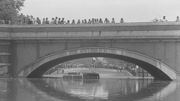 A DTC bus submerged at Minto Bridge, dated August 1990. The fickle nature of the monsoon this year has brought more rain to Mumbai, Mizoram, Bihar and Karnataka, with rain flooded districts in northern Gujarat and Rajasthan for the first time in decades. (N Thyagarajan / HT Photo) A DTC bus submerged at Minto Bridge, dated August 1990. The fickle nature of the monsoon this year has brought more rain to Mumbai, Mizoram, Bihar and Karnataka, with rain flooded districts in northern Gujarat and Rajasthan for the first time in decades. (N Thyagarajan / HT Photo)