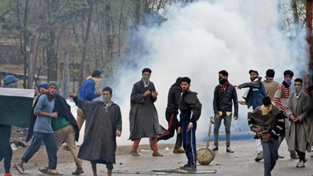 A group of youth pelting stones on security forces during an anti-militant operation at village Durbugh in Chadoora area of central Kashmir's Budgam district. (PTI File Photo) A group of youth pelting stones on security forces during an anti-militant operation at village Durbugh in Chadoora area of central Kashmir's Budgam district. (PTI File Photo)