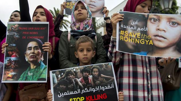 Moroccans, some of them holding placards depicting Nobel Peace Prize winner Aung San Suu Kyi, take part in a protest condemning a crackdown on Rohingya Muslims in Myanmar, on September 8, 2017, in Rabat.(AFP Photo) Moroccans, some of them holding placards depicting Nobel Peace Prize winner Aung San Suu Kyi, take part in a protest condemning a crackdown on Rohingya Muslims in Myanmar, on September 8, 2017, in Rabat.(AFP Photo)