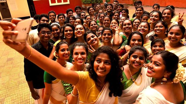 Students of the Malayalam Association take a group selfie dressed in tradition attire. (Anshuman Poyrekar/HT Photo) 