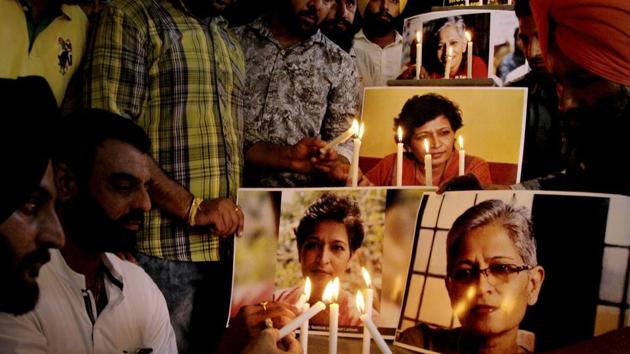 Members of the National Human Rights and Crime Control Organisation in a candle-light vigil in Amritsar on Friday to condemn the killing of journalist Gauri Lankesh. (PTI Photo) Members of the National Human Rights and Crime Control Organisation in a candle-light vigil in Amritsar on Friday to condemn the killing of journalist Gauri Lankesh. (PTI Photo)