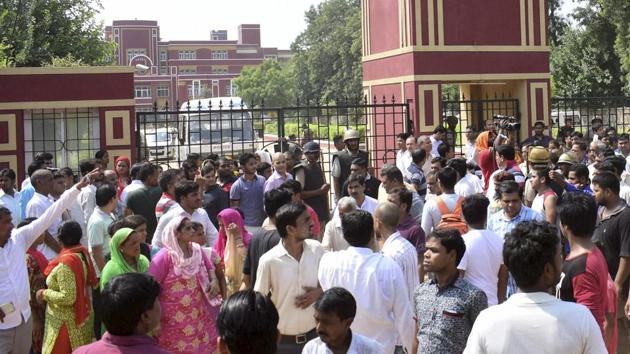 Demonstrators, including parents of students, protest on Saturday outside Gurgaon’s Ryan International School as they demand action against the institute.(PTI)