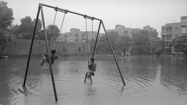 A look at Delhi’s monsoon season from decades ago reveals a picture of joy among its residents, even through the daily inconveniences of wading through water in traffic. (S Burmaula / HT Photo) A look at Delhi’s monsoon season from decades ago reveals a picture of joy among its residents, even through the daily inconveniences of wading through water in traffic. (S Burmaula / HT Photo)
