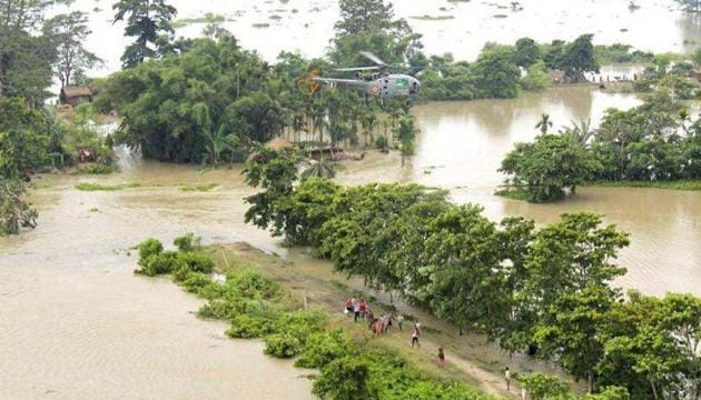Flood-affected people gather below a helicopter carrying relief materials in flooded areas of Sonitpur district of Assam. (Reuters file photo / Representational) Flood-affected people gather below a helicopter carrying relief materials in flooded areas of Sonitpur district of Assam. (Reuters file photo / Representational)