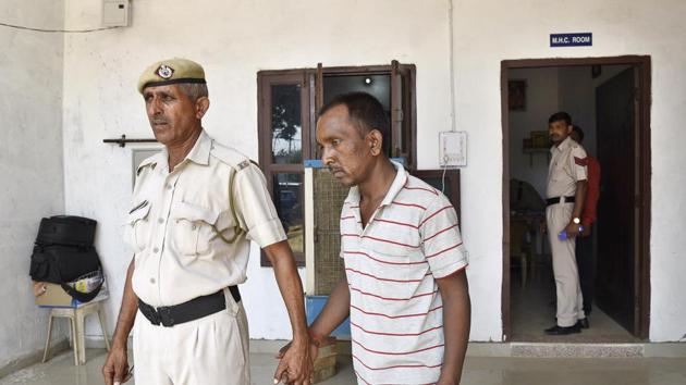 Ashok , a bus conductor accused of murdering an eight-year-old boy of Ryan International School in Bhondsi in police custody at Sona, in Gurgaon. His victim’s father suspects the murder was planned. (HT PHOTO) Ashok , a bus conductor accused of murdering an eight-year-old boy of Ryan International School in Bhondsi in police custody at Sona, in Gurgaon. His victim’s father suspects the murder was planned. (HT PHOTO)