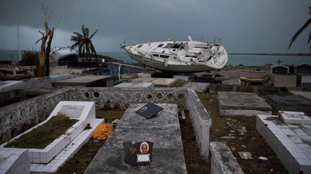 A sailing boat is beached in the cemetery of Marigot, on September 9, 2017 in Saint-Martin island devastated by Irma hurricane. From the devastating hurricane Irma to the mass migration of Rohingya refugees, photos of the week from around the world. (Martin Bureau / AFP) A sailing boat is beached in the cemetery of Marigot, on September 9, 2017 in Saint-Martin island devastated by Irma hurricane. From the devastating hurricane Irma to the mass migration of Rohingya refugees, photos of the week from around the world. (Martin Bureau / AFP)