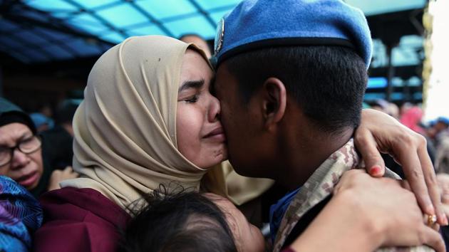 Mohd Farhan (R), 27, a member of the Malaysian armed forces, hugs his wife Siti Salwa, 27, after a dispatching ceremony for the first batch of the Malaysian Battalion 850-5 for the United Nations Interim Force in Lebanon (UNIFIL) at the Subang Air Force base near Kuala Lumpur on September 7, 2017. Malaysia sent about 850 troops to Lebanon to take part in UN peacekeeping activities. (AFP) Mohd Farhan (R), 27, a member of the Malaysian armed forces, hugs his wife Siti Salwa, 27, after a dispatching ceremony for the first batch of the Malaysian Battalion 850-5 for the United Nations Interim Force in Lebanon (UNIFIL) at the Subang Air Force base near Kuala Lumpur on September 7, 2017. Malaysia sent about 850 troops to Lebanon to take part in UN peacekeeping activities. (AFP)