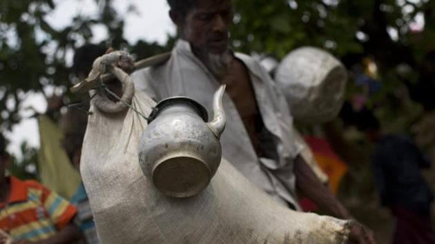 A Rohingya Muslim man arrives with a sack of belongings and a kettle and other utensils tied to a stick as he crosses the border into Bangladesh's Teknaf area. Many Rohingya report entire villages being burnt to the ground as they fled from the Rakhine state, leaving scant remnants of their presence in the region. (Bernat Armangue / AP) A Rohingya Muslim man arrives with a sack of belongings and a kettle and other utensils tied to a stick as he crosses the border into Bangladesh's Teknaf area. Many Rohingya report entire villages being burnt to the ground as they fled from the Rakhine state, leaving scant remnants of their presence in the region. (Bernat Armangue / AP)