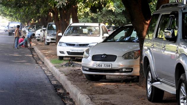 Parking on the green belts in Sector 43, Chandigarh. (HT File) Parking on the green belts in Sector 43, Chandigarh. (HT File)