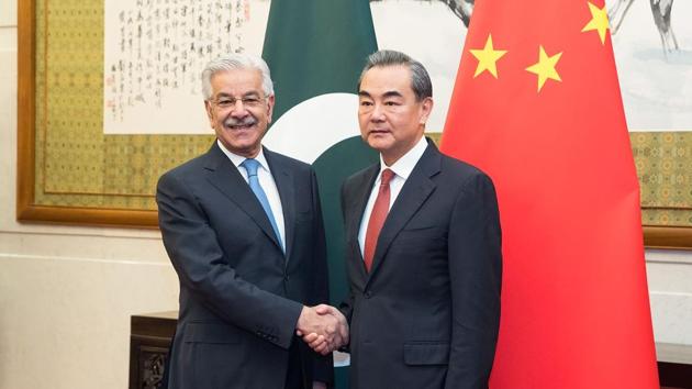 Chinese foreign minister Wang Yi (R) shakes hands with Pakistan's foreign minister Khawaja Muhammad Asif (L) at Diaoyutai State Guesthouse in Beijing on September 8. (AFP file) Chinese foreign minister Wang Yi (R) shakes hands with Pakistan's foreign minister Khawaja Muhammad Asif (L) at Diaoyutai State Guesthouse in Beijing on September 8. (AFP file)