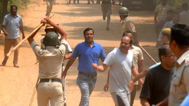 Police used lathis to control protesters who set fire to a liquor shop near Ryan International School, in Gurgaon on Sunday. Police used lathis to control protesters who set fire to a liquor shop near Ryan International School, in Gurgaon on Sunday.