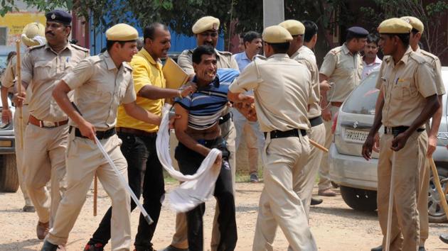 Police used batons to control protesters who set fire to a liquor shop near Ryan International School in Gurgaon on Sunday. (HT Photo / Parveen Kumar) Police used batons to control protesters who set fire to a liquor shop near Ryan International School in Gurgaon on Sunday. (HT Photo / Parveen Kumar)