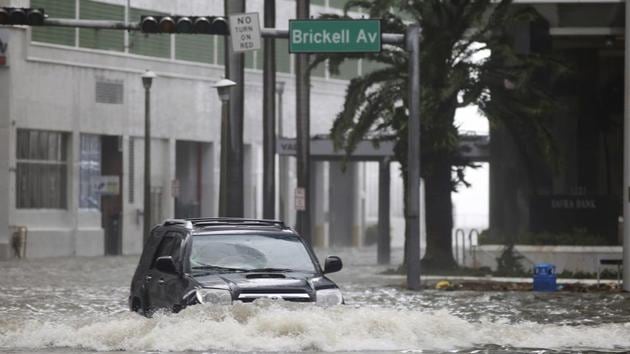 A vehicle drives on flooded Brickell Avenue in Miami on Sunday as Hurricane Irma passes. (AP Photo) A vehicle drives on flooded Brickell Avenue in Miami on Sunday as Hurricane Irma passes. (AP Photo)