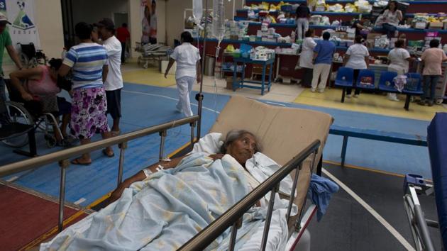 A 71-year-old woman, who was injured when a wall collapsed on her in Thursday's massive earthquake, receives treatment in a medical ward set up on a school's basketball court, in Juchitan, Mexico. Juchitan General Hospital moved their operations to the basketball court after being devastated in the quake. (Rebecca Blackwell / AP) A 71-year-old woman, who was injured when a wall collapsed on her in Thursday's massive earthquake, receives treatment in a medical ward set up on a school's basketball court, in Juchitan, Mexico. Juchitan General Hospital moved their operations to the basketball court after being devastated in the quake. (Rebecca Blackwell / AP)